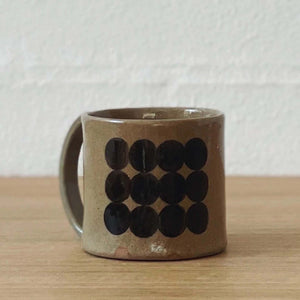Taupe mug with black dot print