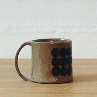 Taupe mug with black dot print